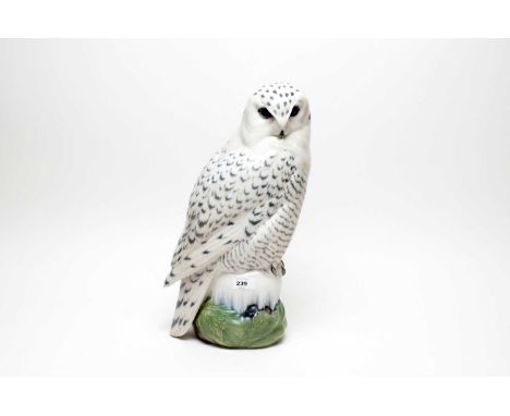 A Royal Copenhagen ceramic figure of a snowy owl, no. 1829, 39cms high. 