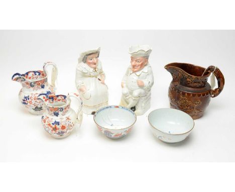 A Victorian salt glazed hunting jug, with panoramic hunting scene and dog form handle, 21cms high; together with a pair of St