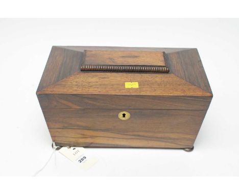 A 19th century rosewood sarcophagus tea caddy raised on bun feet, approximately 28cms wide.