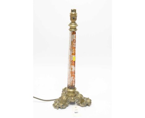 A Victorian style gilt metal mounted table lamp, the tapering hexagonal glass pillar support with amber overlay and etched le