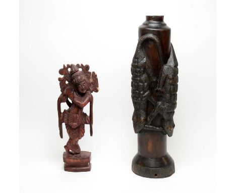A West African carved and ebonised wood lamp base or sculpture, decorated with crocodiles in high relief, lacking light fitti