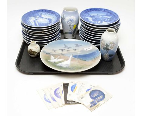 A collection of Royal Copenhagen decorative ceramic wares, including: blue and white Christmas plates, approximately 21, each