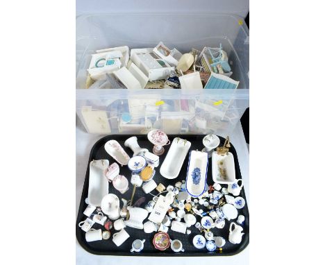 A collection of dolls house ceramic bathroom furnishings, including baths and other items; together with other dolls miniatur