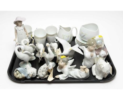 A collection of Lladro figures, including: a polar bear; a Dalmatian puppy; six geese; cherubs; and others; together with a N