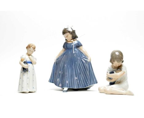A collection of three Royal Copenhagen decorative ceramic figures, including: Dancing Girl, 20cms high; Girl with Doll in her