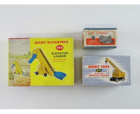 A group of DINKY comprising a 563 Heavy Tractor, a 964 Elevator Loader and a 971 Coles Mobile Crane (G in F/G boxes) (3)