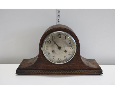 A antique wood cased mantle clock 