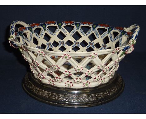 19th C Continental pierced work twin handled ceramic fruit basket with transfer printed floral detail the base marked 80836 o