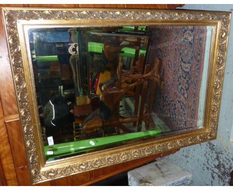Gilt framed bevelled edge wall mirror 