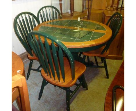 Tile top circular extending dining table and set of four chairs 