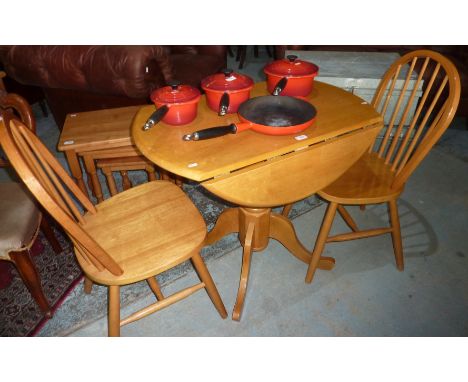 Lightwood drop leaf table and two stick back dining chairs 