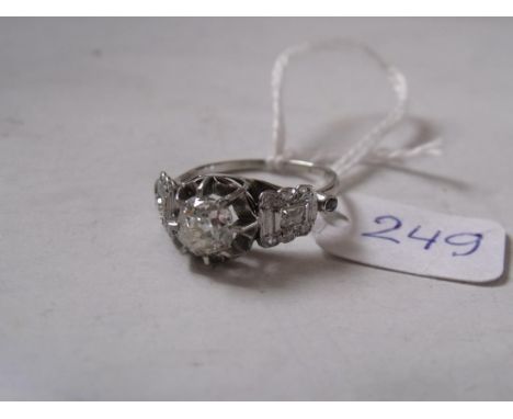 AN IMPRESSIVE ANTIQUE DIAMOND SOLITAIRE  ring set with diamond shoulders the central diamond  1.04 carats approx size 'N'    