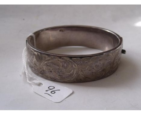 A wide silver engraved bangle 28g     