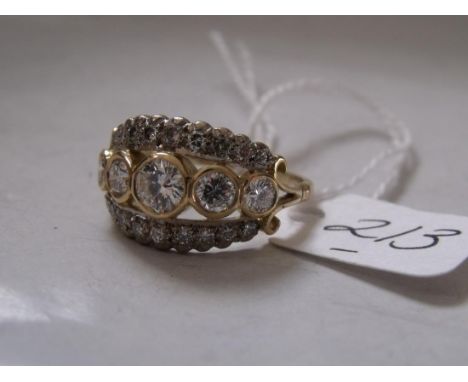 A FINE QUALITY 18CT GOLD THREE ROW DIAMOND RING. The five central diamonds amounting to 1.16 carats in total approx size 'T' 