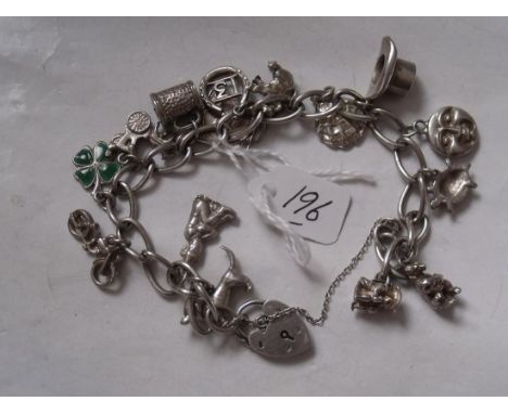 A vintage silver charm bracelet including moon faced charm 50g inc      