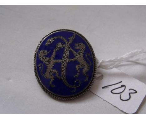 An oval blue enamel & silver brooch     