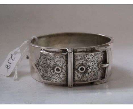 An antique silver embossed buckle bangle 27.6g   