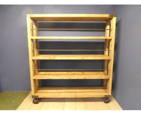 Vintage &amp; decorative freestanding shelf unit raised on industrial wheels&nbsp;