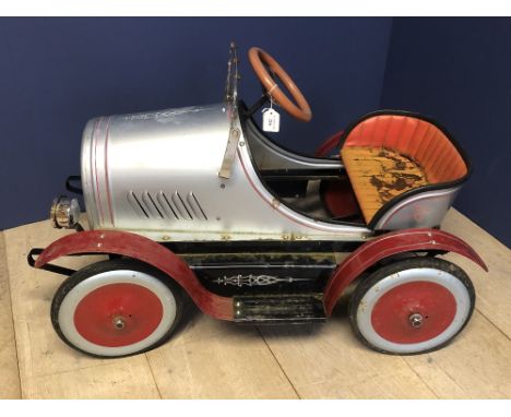 A Child's Vintage pedal car, with red wheels and silver body work,    cmL 