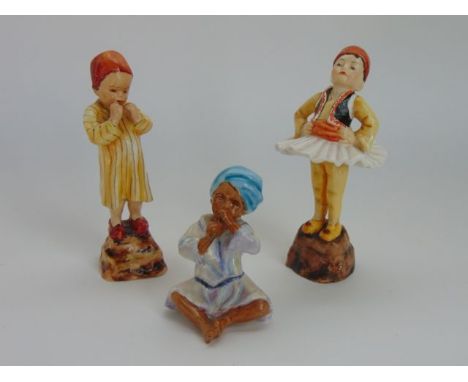 A collection of three Royal Worcester figures representing children of the world and modelled by F G Doughty comprising Greec