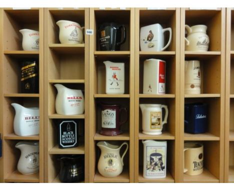 An extensive collection of various ceramic jugs relating to Scotch whisky including examples for Bells, Jonny Walker Black La