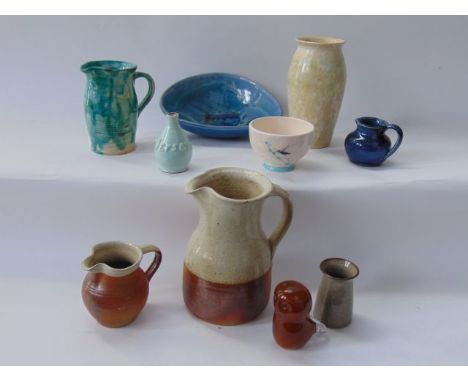 A collection of Studio Pottery wares including a Winchcombe Pottery jug with cream glazed band to the top rim, with seal mark