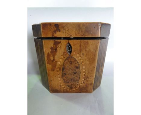 A Georgian tea caddy of hexagonal form, principally in walnut veneer with banded borders and inlaid medallions with further b