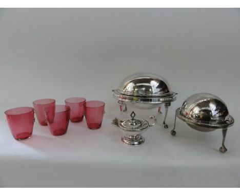 A silver plated small breakfast warming dish of oval form raised on paw supports, a further smaller warming dish and a silver