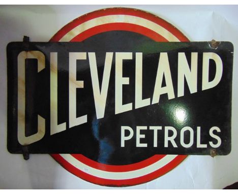 A vintage double sided enamel sign for Cleveland Petrols, the white text set within a black rounded rectangular ground, set b