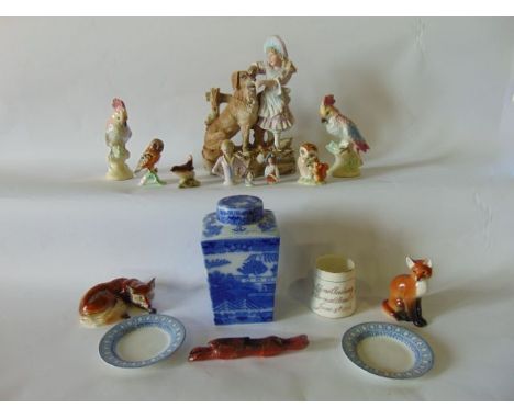 A collection of ceramics including a late 19th century continental bisque group of a young girl feeding a large dog, a four s