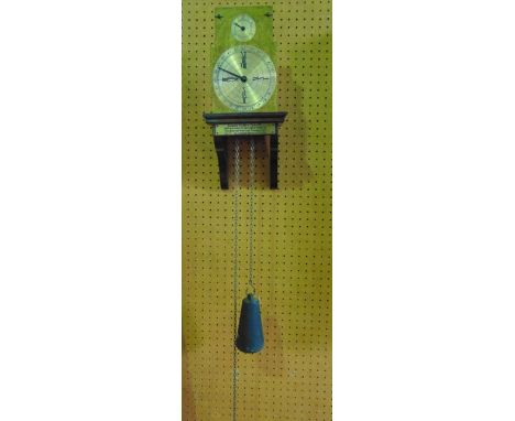 A reproduction Benjamin Franklin wall clock by Thwaites & Reed, Bowling Green Lane, London, the spherical silvered dial set b