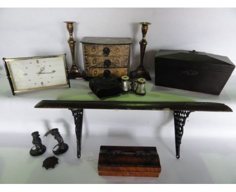 An antique lacquered sarcophagus shaped tea caddy with embossed acorn brass plaque to lock escutcheon and a floral bouquet to