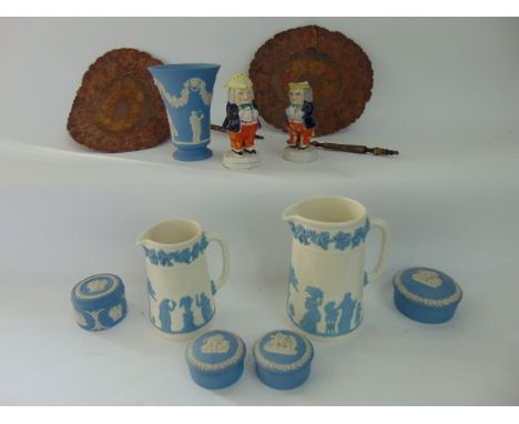 A collection of ceramics including Wedgwood blue ground jasperwares comprising a vase and four various trinket boxes and cove