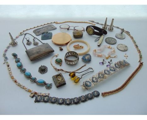 A Siam sterling silver and niello enamelled demi-parure, comprising: two bracelets, a brooch and a pair of earrings, 65g; a f