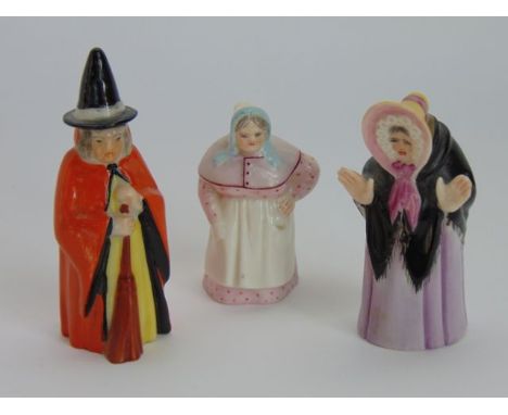 A collection of three Royal Worcester candle snuffers in the form of a witch in orange cloak, number 2543, Granny Snow with o