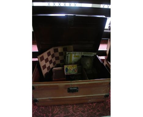 A substantial Victorian tin trunk with domed top and hinged lid, with brown painted finish and highlighted handles, corner pl