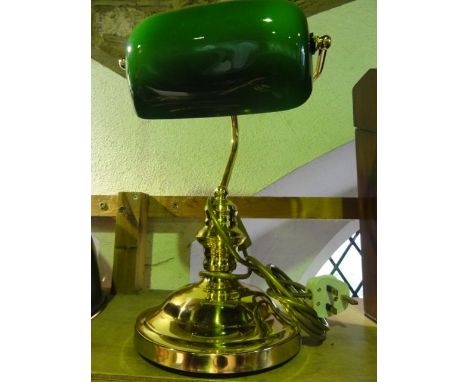 A reproduction desk lamp, principally in brass with an opaque lined green glass shade of rectangular form, 35 cm tall approx 