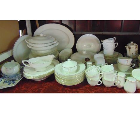 An extensive collection of Royal Worcester Strathmore pattern dinner and tea wares with white glaze and gilt border decoratio