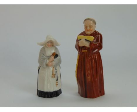 Two Royal Worcester candle snuffers in the form of a monk and a nun, both with puce printed marks to interior