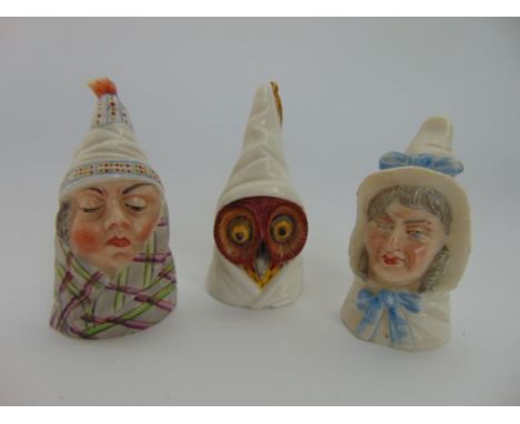 A collection of three Royal Worcester candle snuffers in the form of Mr Caudle, Mrs Caudle and an owl, all wearing night caps