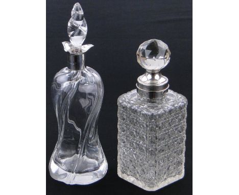 A glass decanter with stopper and silver collar,
height 12" and a hob nail cut decanter and stopper.