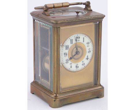 A French brass cased carriage clock,
with repeat movement and enamelled dial, height 5.75".