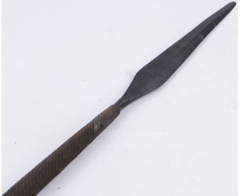 An unusual short Zulu spear,
with allover brass wirework and button end, 56.5".