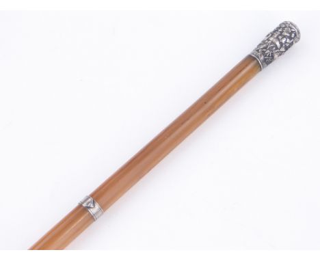 A 19th century Chinese rhinoceros horn riding crop,
with relief-decorated unmarked silver top and collar, length 33". Accordi