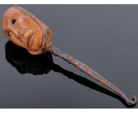 A button hook,
with carved nut handle in the form of a head, length 4.8".