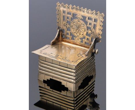 A Russian silver gilt trinket box in the form of a chair,
with rising seat and engraved decoration, makers marks K B, marked 