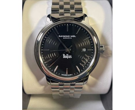 An original c 2017 Beatles watch by Raymond Weil, Geneva. With original case and outer slipcase as well an original guarantee