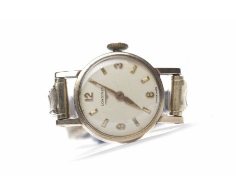 LADY'S LONGINES NINE CARAT GOLD MANUAL WIND WRIST WATCHsigned 17 jewels movement, the round white dial with applied Arabic nu
