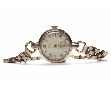 LADY'S SMITHS NINE CARAT GOLD MANUAL WIND WRIST WATCHthe round white dial with applied gold coloured Arabic numerals and wedg
