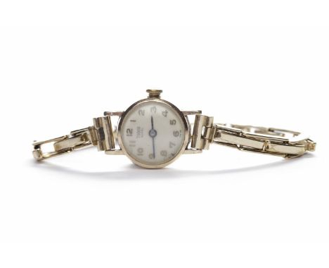 LADY'S TUDOR MANUAL WIND WRIST WATCHthe round white dial with applied gold coloured Arabic numerals, the 16mm case blank to t